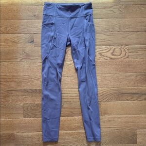 Athleta girls Purple Leggings with side pockets new without tags